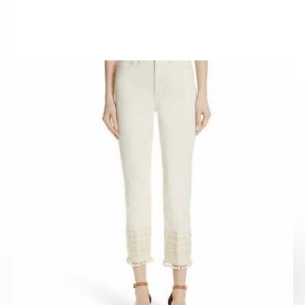 TORY BURCH “Lana” stretch denim jeans adorned w/ embroidered cuff and  Pom hem
